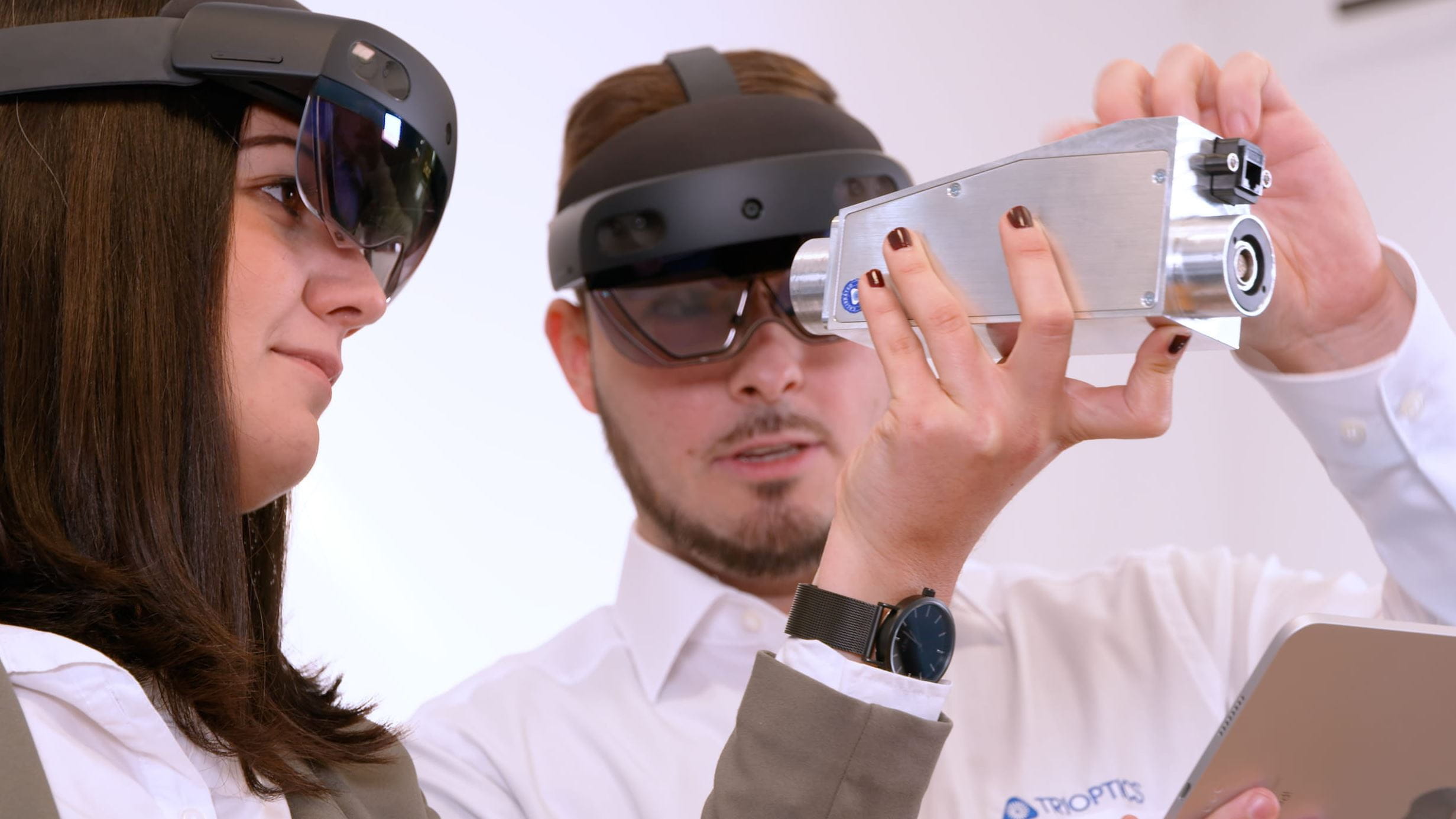 Two people with AR glasses